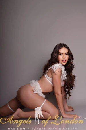 London escort Misseta in lingerie on knees