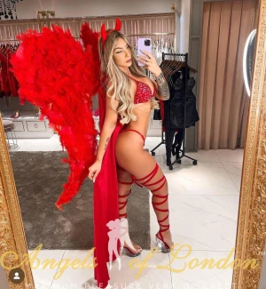 London escort Pava in carnival clothes